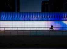 <a href="https://landscapearchitecturebuilt.com/staging/4th-street-underpass-enhancement">4th Street Underpass Enhancement</a>, <br>Calgary, AB, Canada An image of landscape architecture project 4th Street Underpass Enhancement, by design firm the marc boutin architectural collaborative inc., in Calgary, AB, Canada. Showing a people walking along an underpass sidewalk with a colorful digital screen behind them.