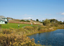 <a href="https://landscapearchitecturebuilt.com/staging/camphill-ghent">Camphill Ghent Elder Care Initiative</a>, <br>Chatham, NY, USA An image of a landscape architecture project in New York state, showing a pond skirted by riparian planting and lawn