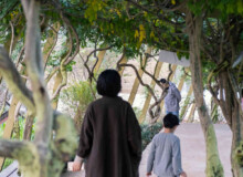 <a href="https://landscapearchitecturebuilt.com/staging/tangshan-ape-man-cave">Tangshan Ape Man Cave</a>, <br>Nanjing, China Landscape architecture project in China showing a walkway with trees either side creating a canopy.