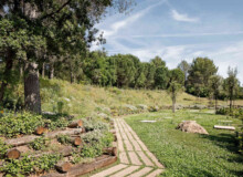 <a href="https://landscapearchitecturebuilt.com/staging/forest-path-roques-blanques">Forest path in the Roques Blanques Cemetery</a>, <br>Barcelona, Spain
