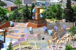 <a href="https://landscapearchitecturebuilt.com/zorlu-center">Zorlu Center</a>, <br>Istanbul, Turkey An image of landscape architecture project Zorlu Center, by design firms Carve & WATG, London, in Istanbul, Turkey. Showing a complex play structure with ropes, climbing walls, platforms and a large colorful slide.